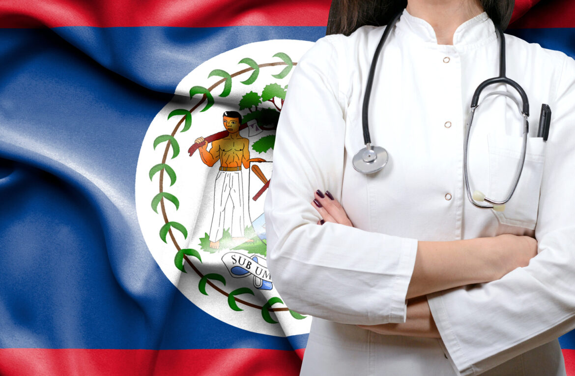Health Care Worker with Belizean Flag behind them