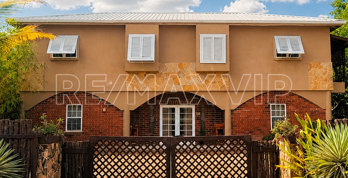 The front of the multi-family compound for sale in Placencia, Belize